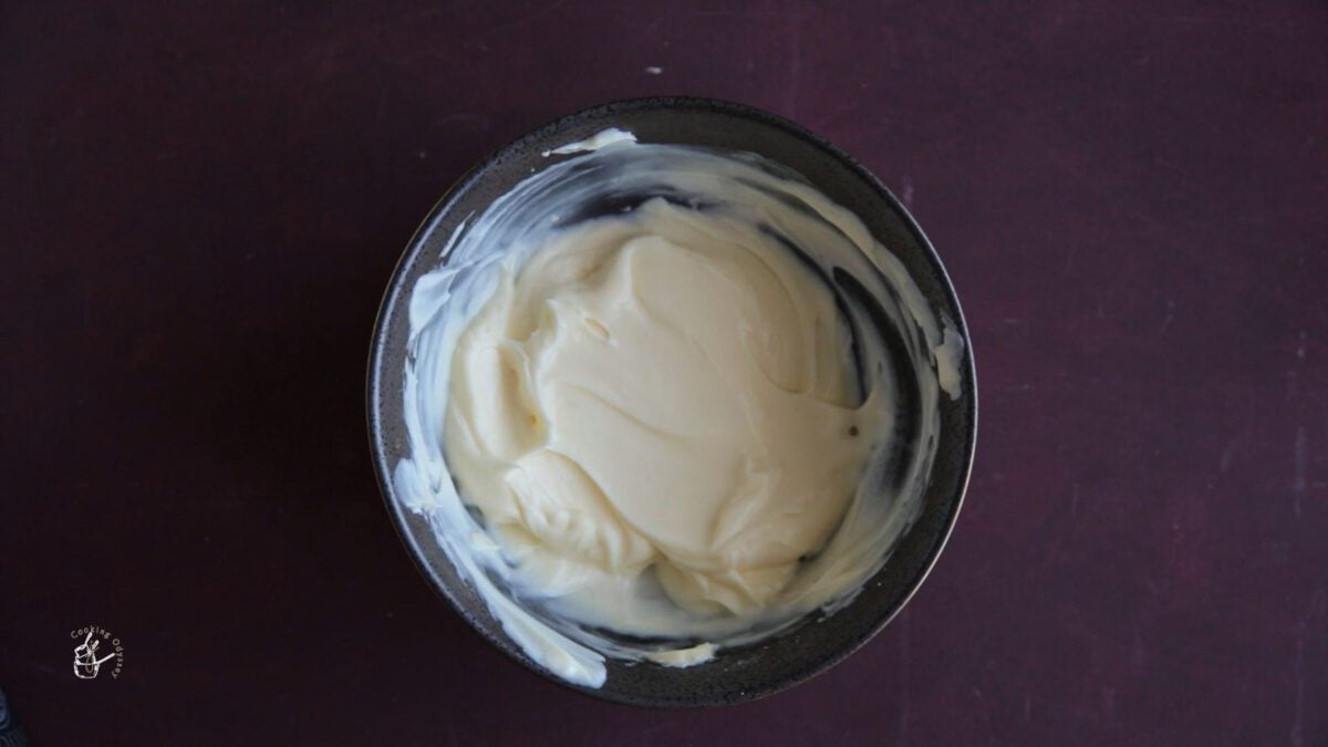 gulab jamun cheese cake filling in a mixing bowl