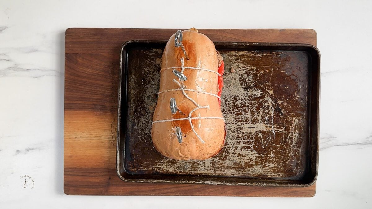 stuffed butternut squash tied with white strings 