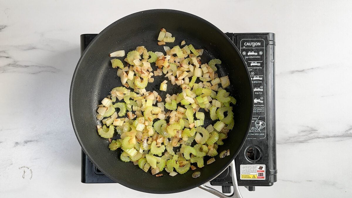 cooked celery and onion in the frying pan
