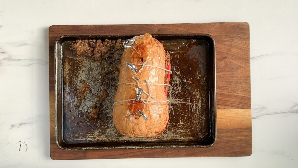 whole roasted butternut squash on a baking tray