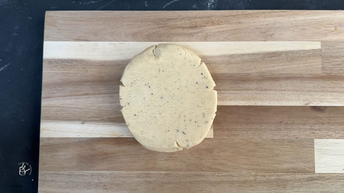 Barfi biscuits dough rolled on a wooden board