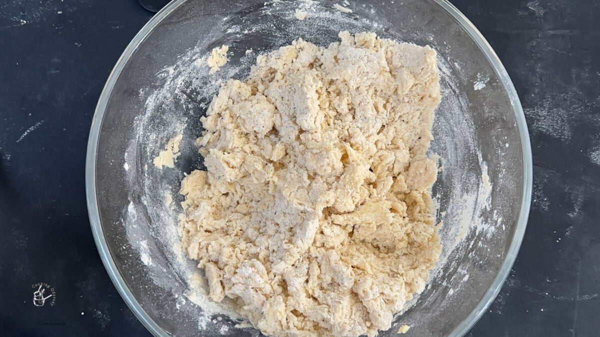 milk powder biscuits dough in a clear mixing bowl