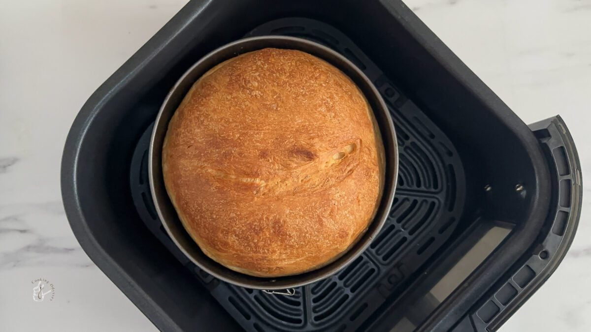 baked bread in the air fryer basket.
