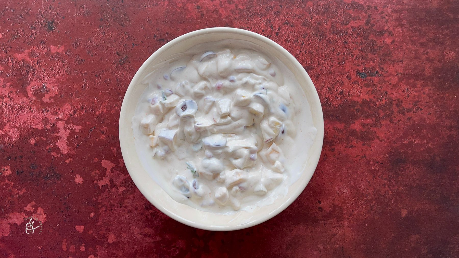 chopped fruit and yogurt mixed in a bowl.