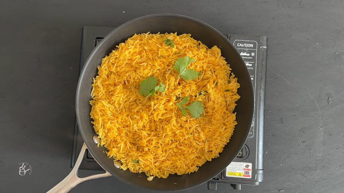 cooked Fried rice in a pan on the stovetop.