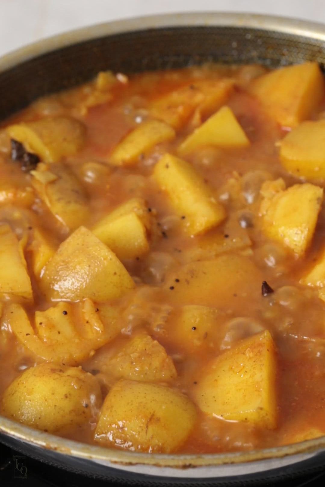 cooked batata nu shaak with rich, thick gravy.