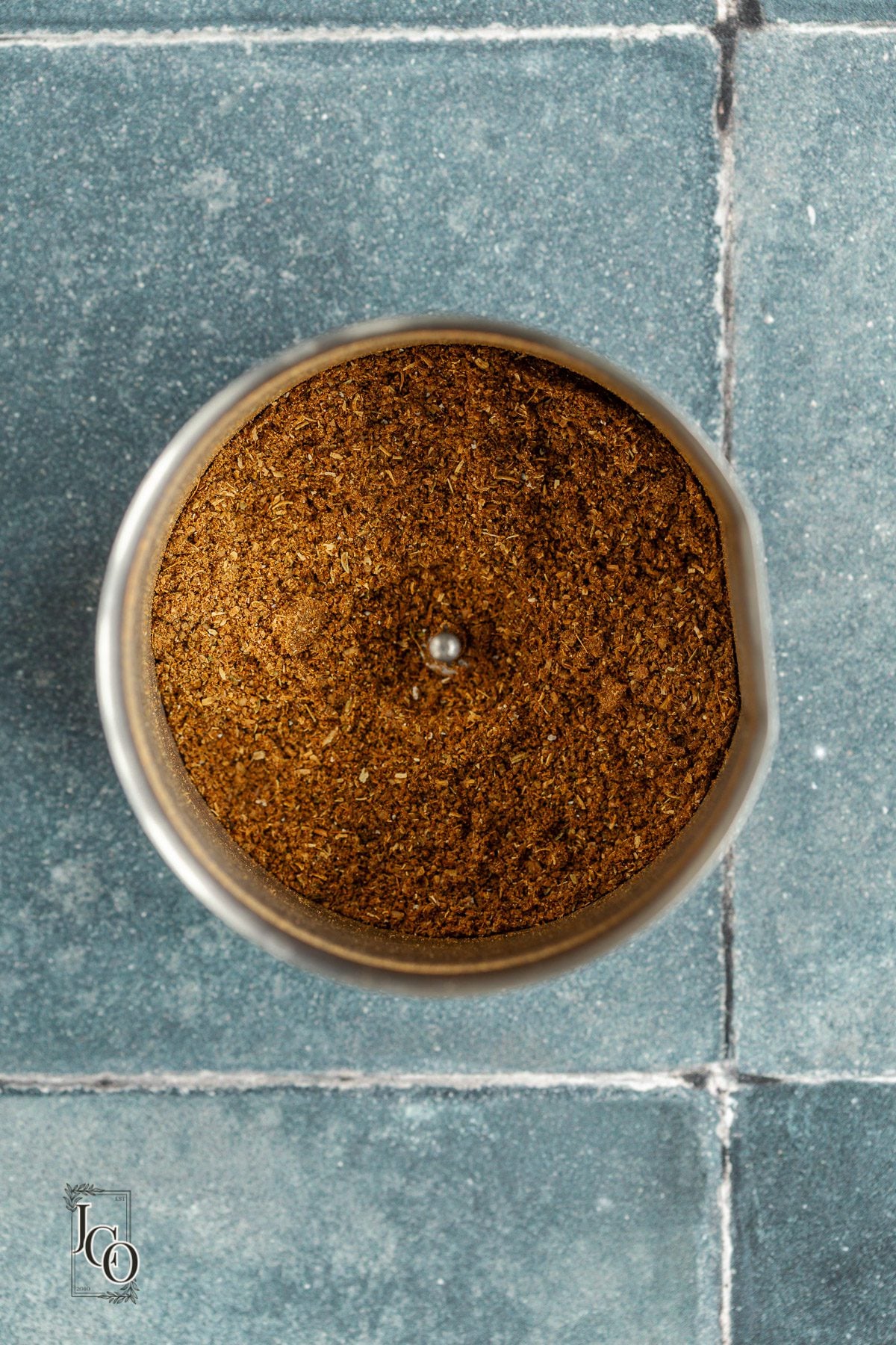Ground spices in a spice grinder.