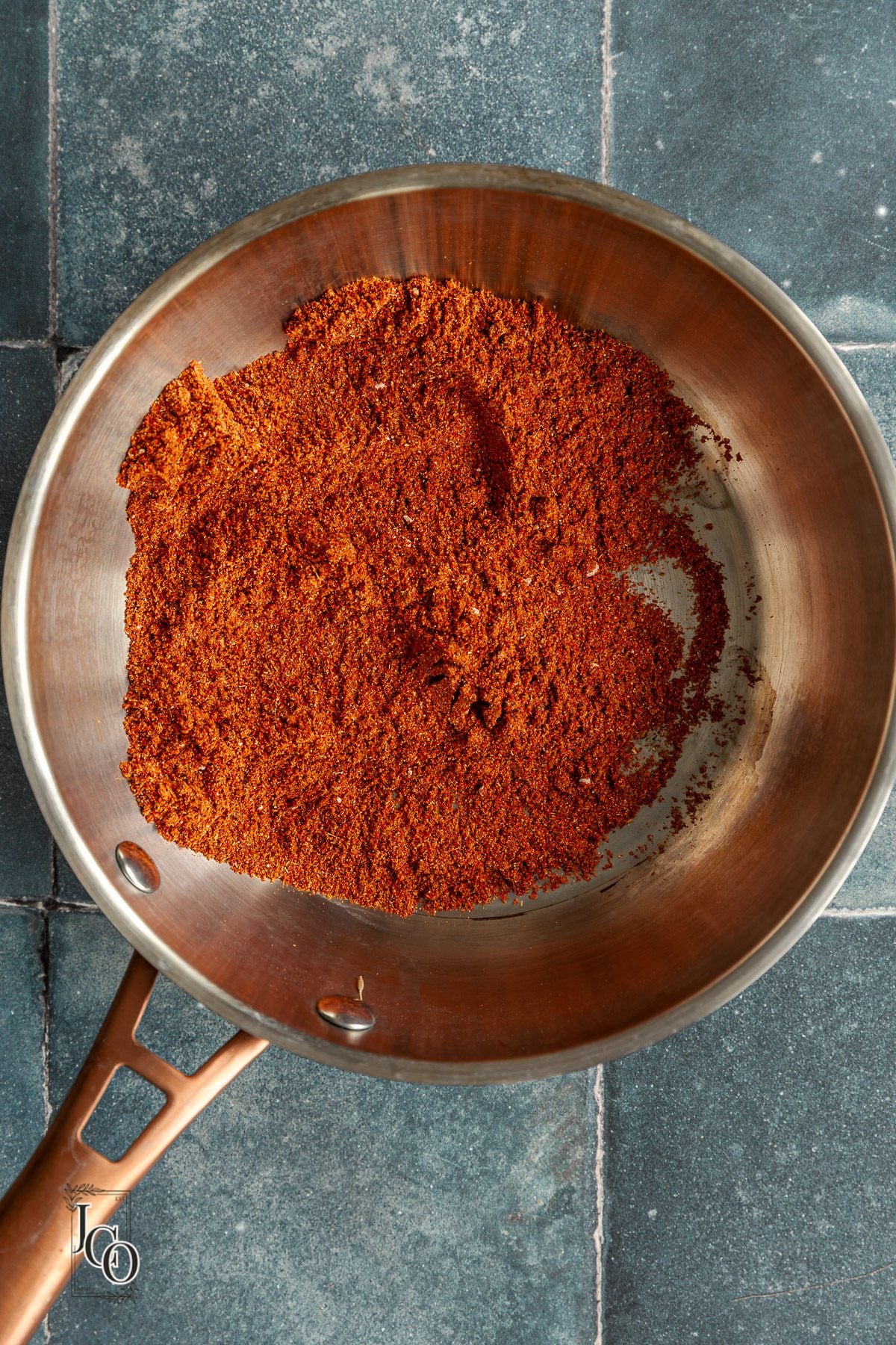 Red tandoori masala mix in a pan.