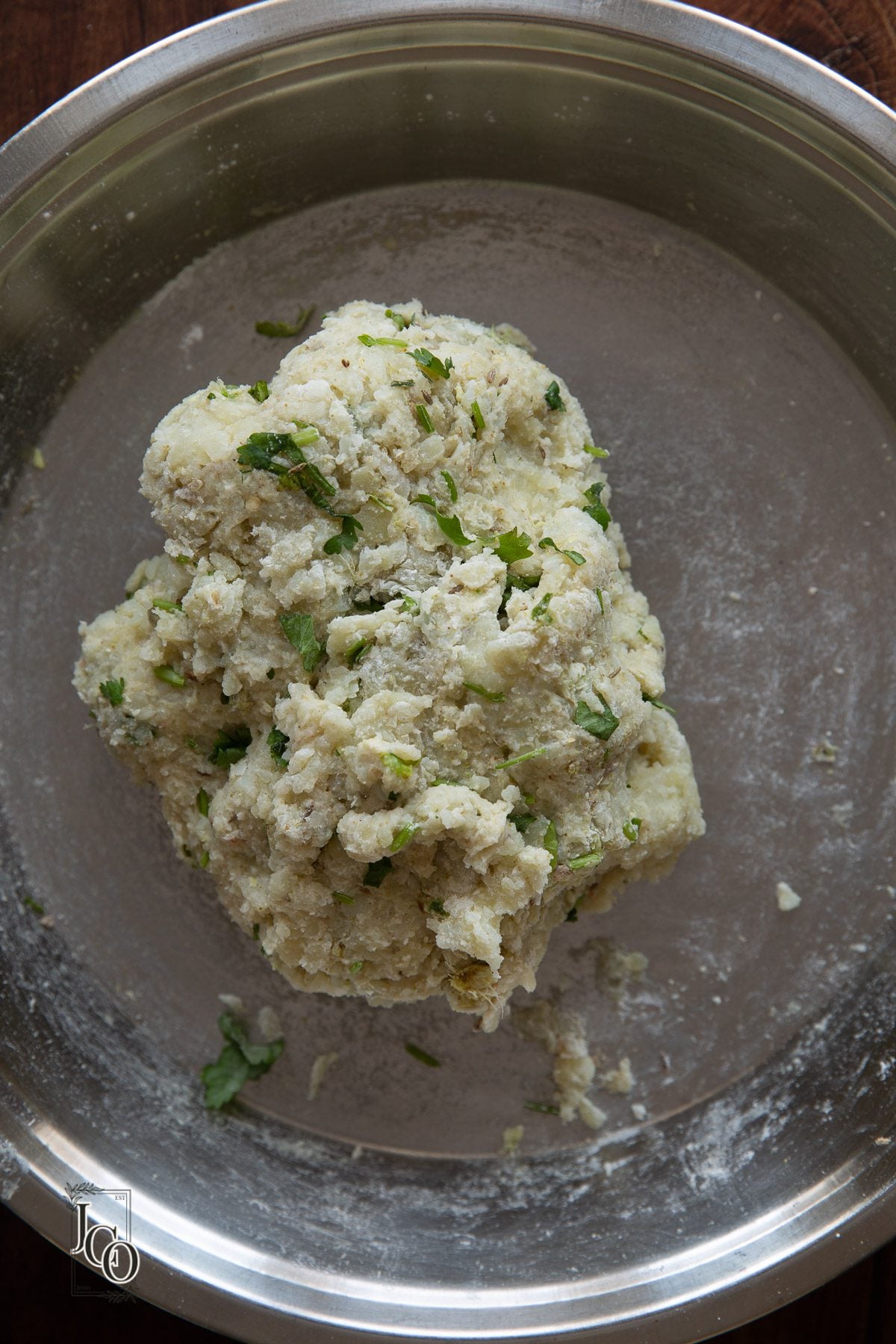 Raw spicy potato mixture in a plate to make aloo tikkis.