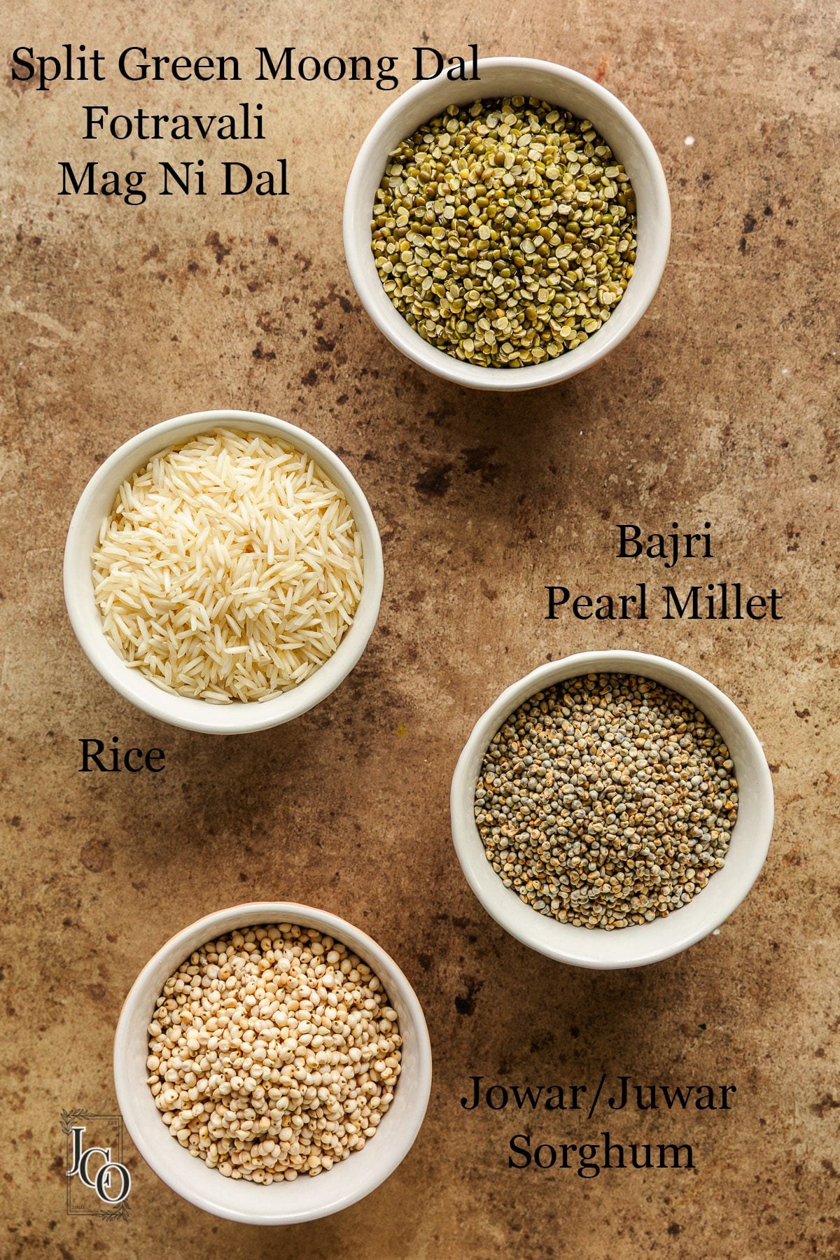 Raw ingredients of Bhaidku pre-mix in small white bowls.