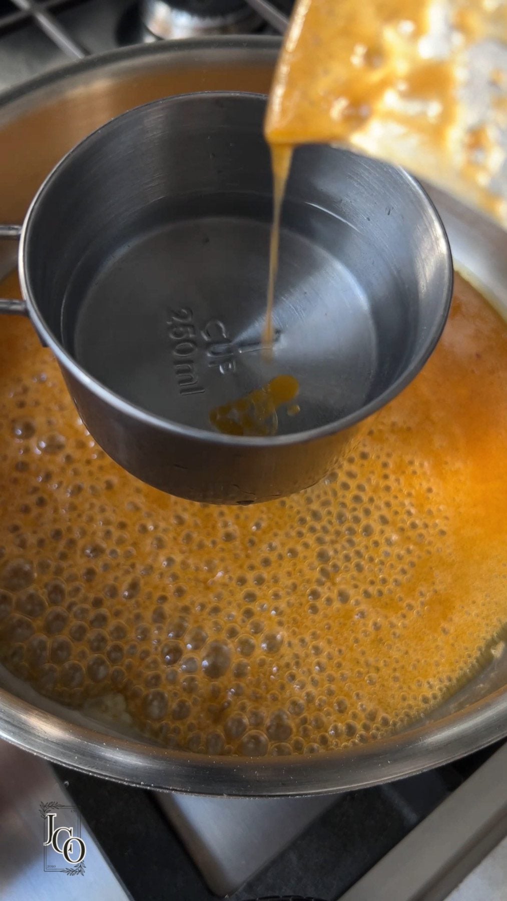 Jaggery syrup in a pan.