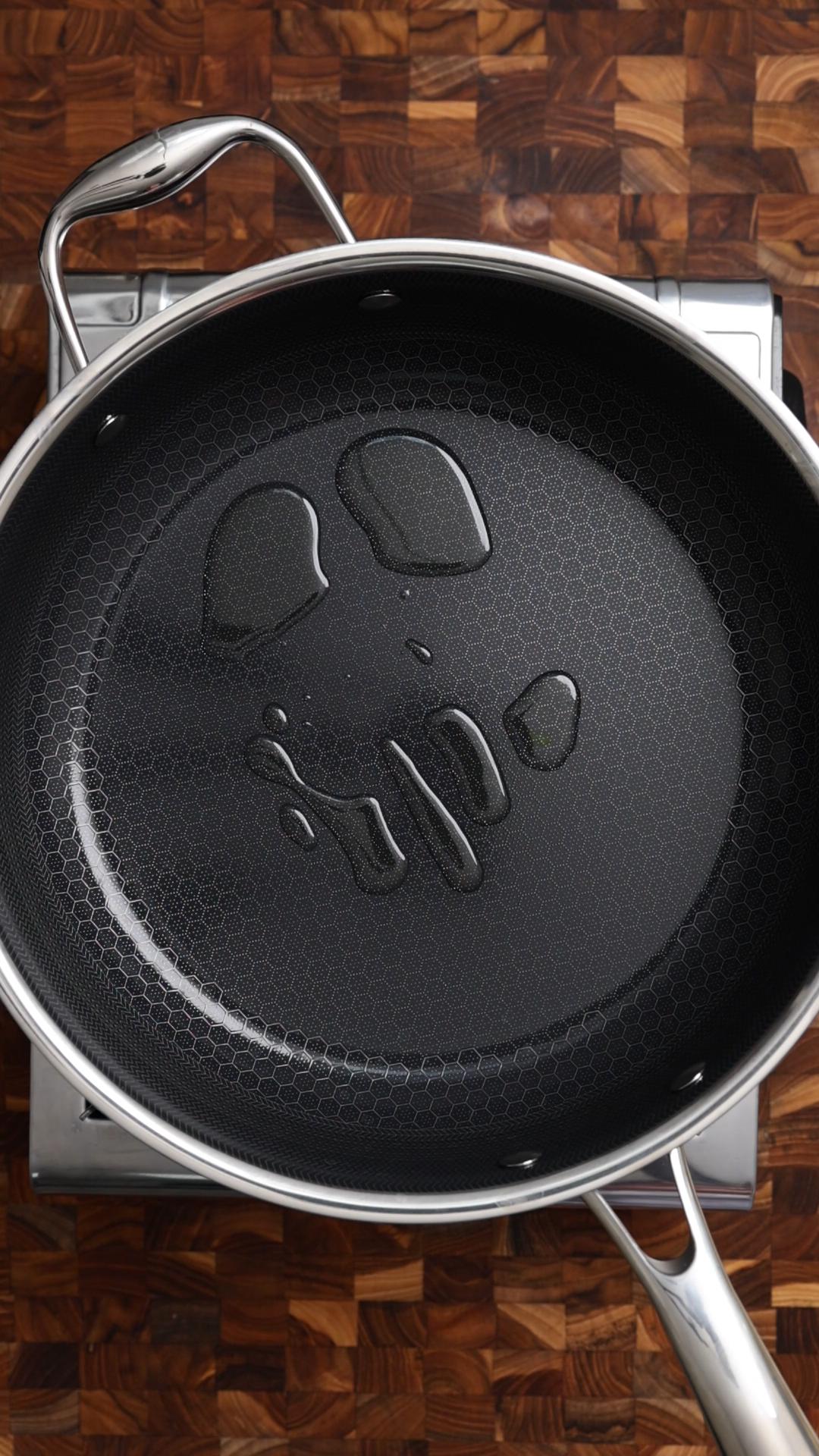 Oil is heating in a pan.