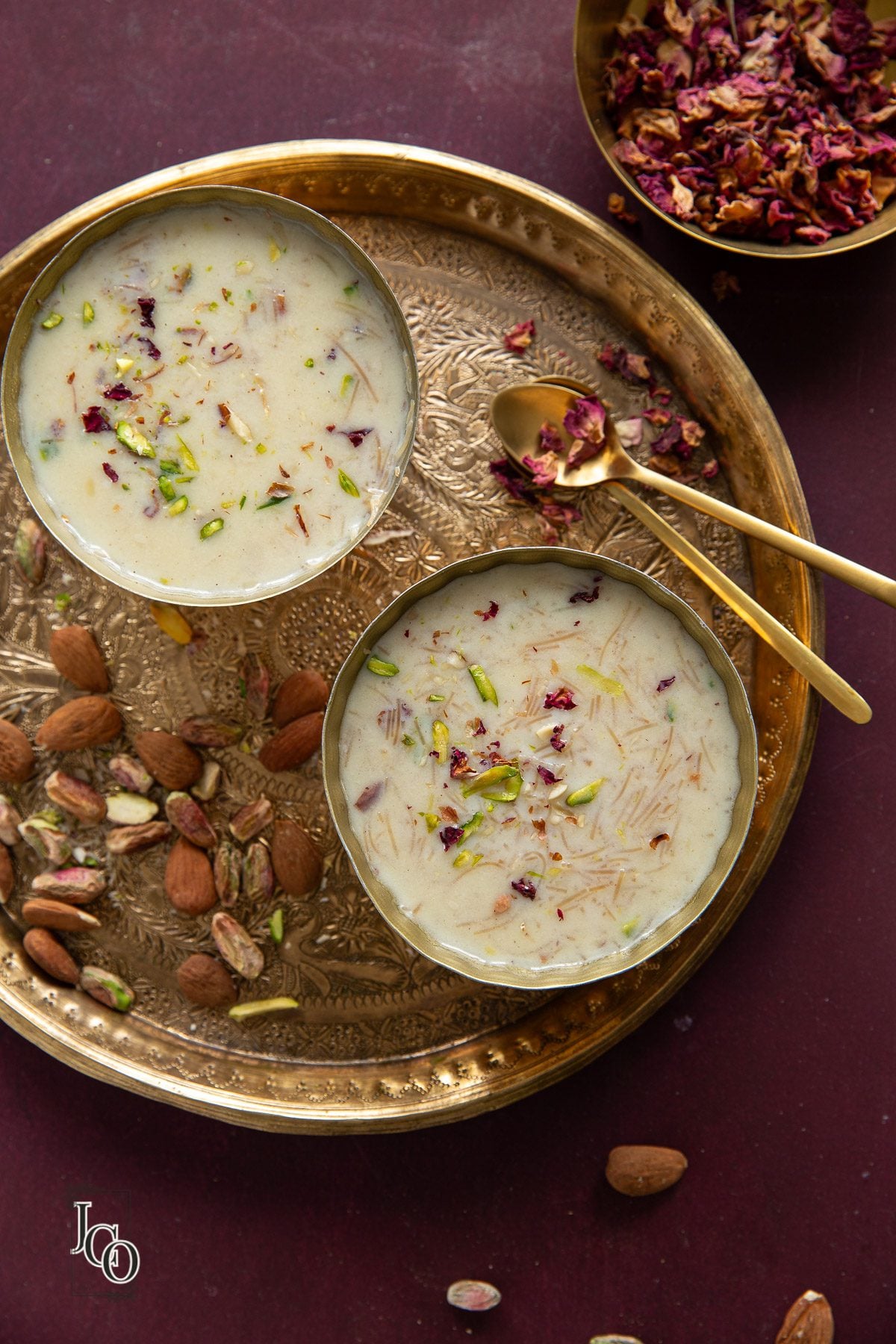 Seviyan kheer served in two serving bowl with spoons on the side. 