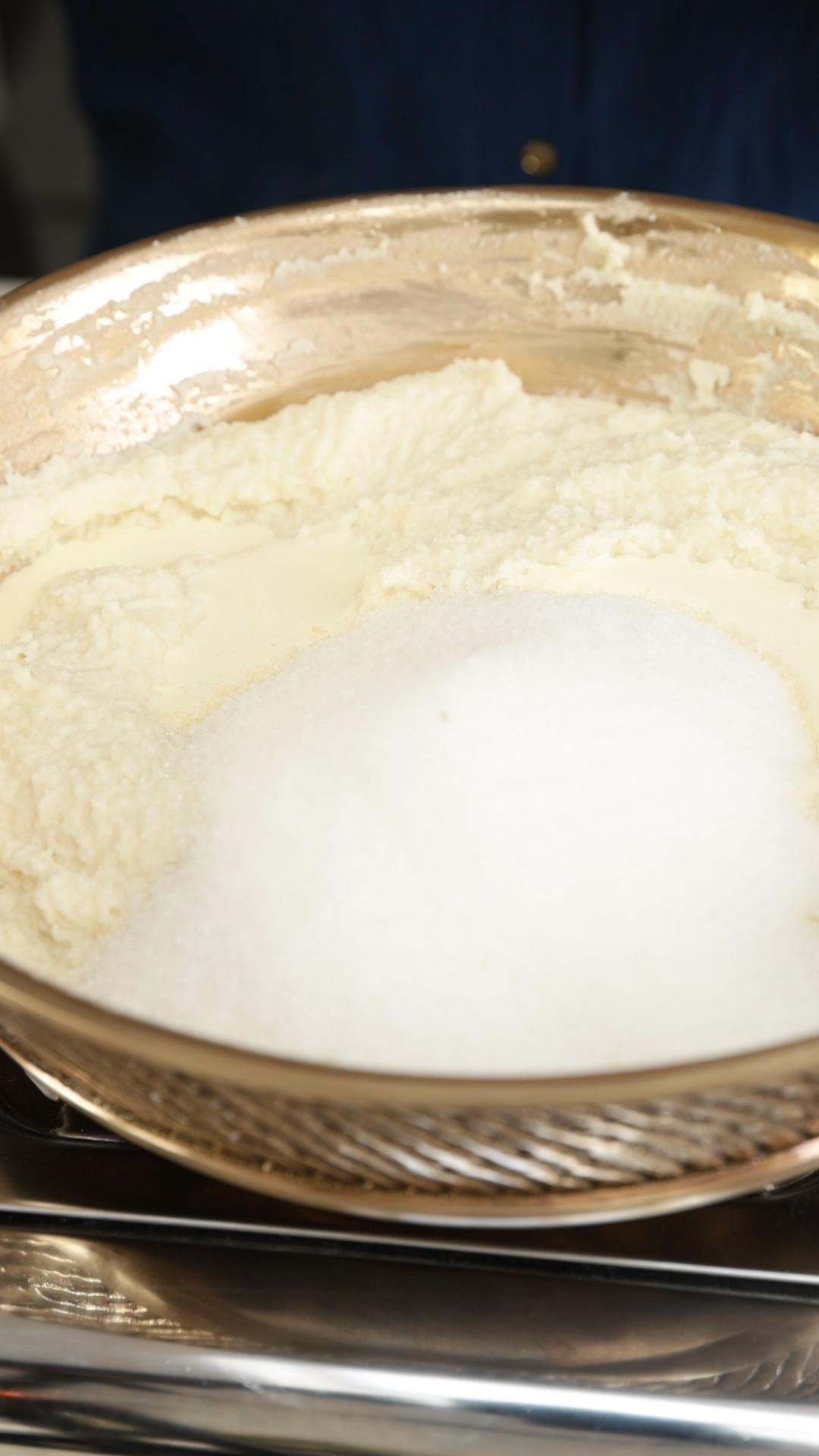 Sugar added to the coconut almond ladoo mixture. 