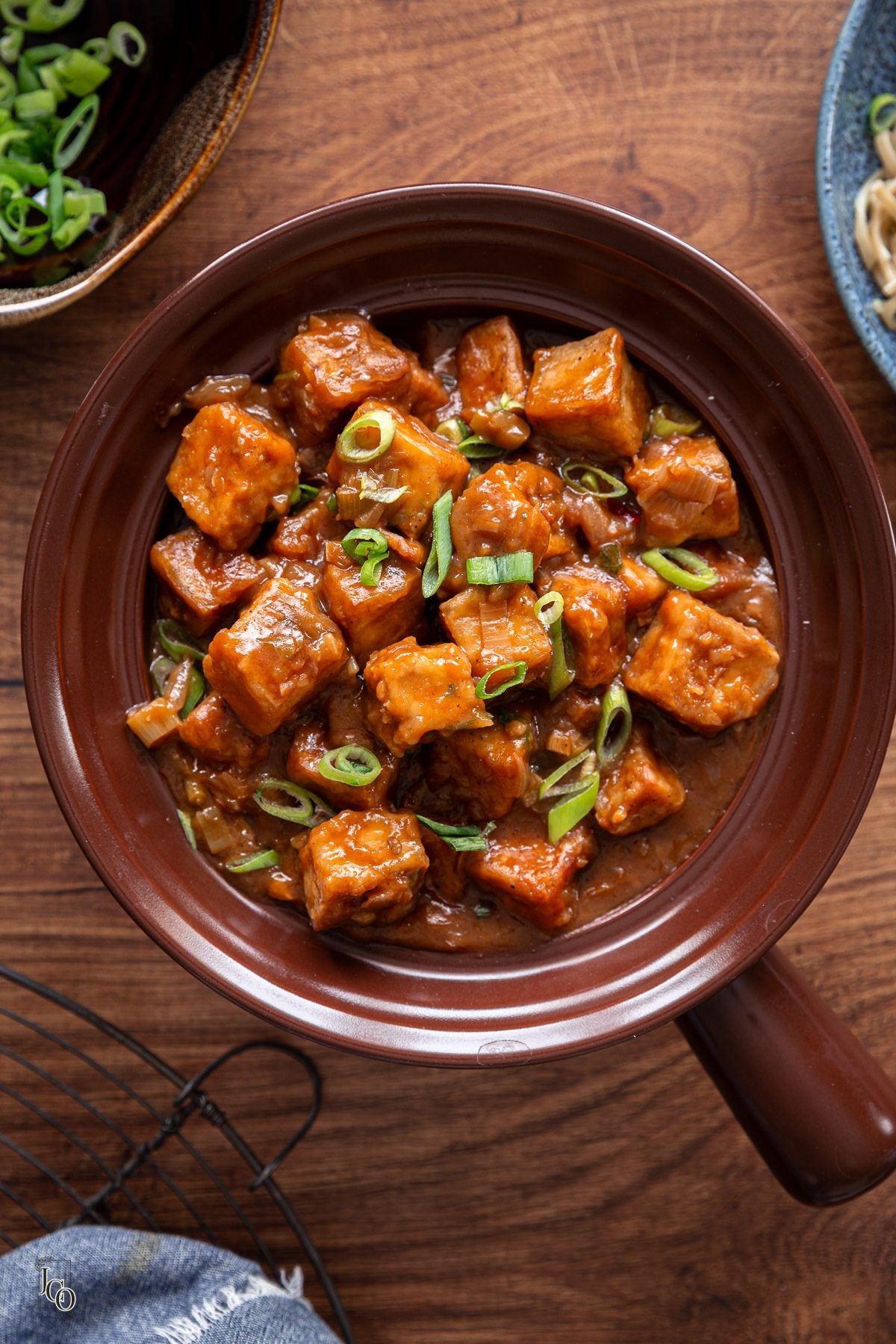 Tofu manchurian served in a brown serving bowl.