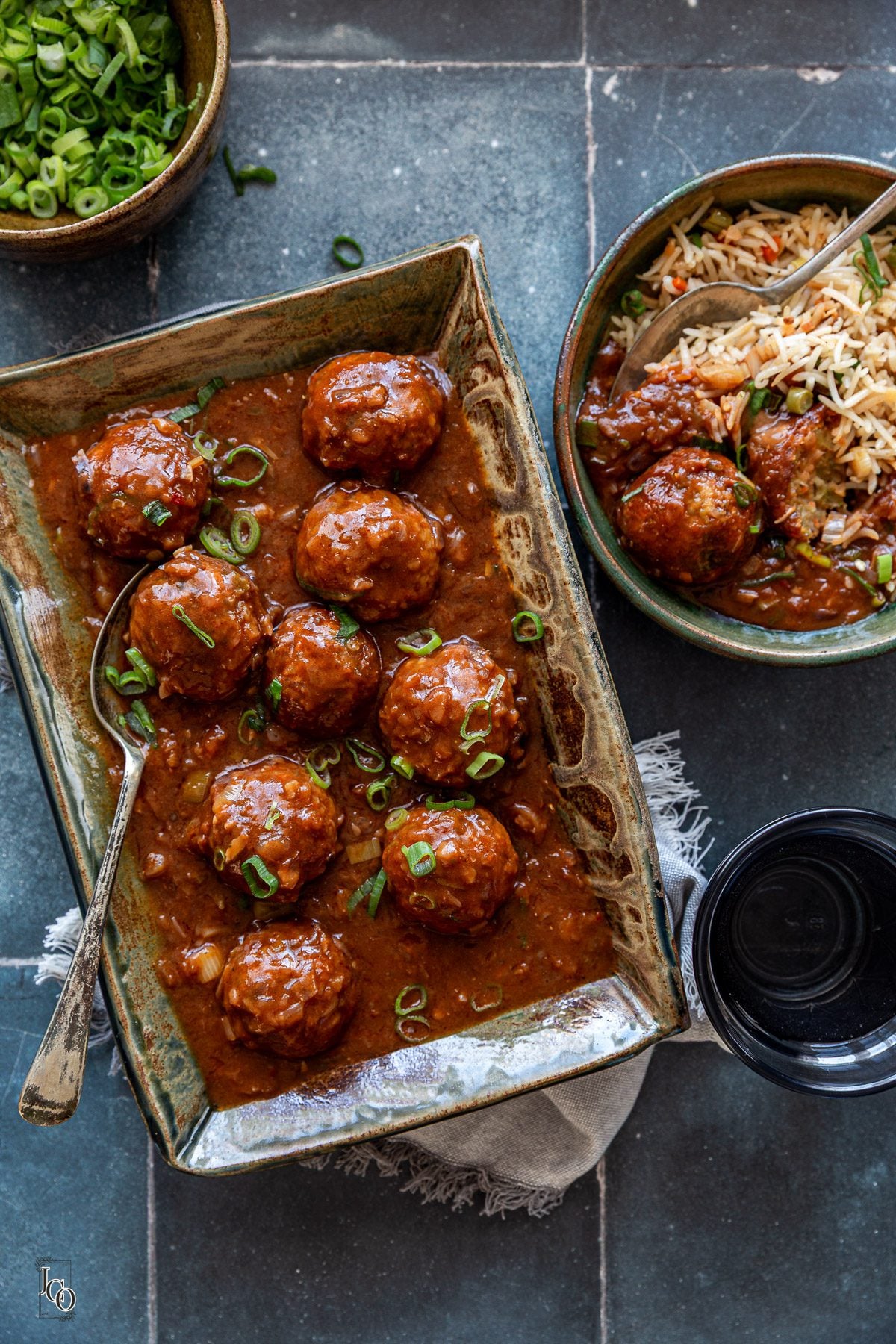 Veg manchurian served with fried rice in a bowl.