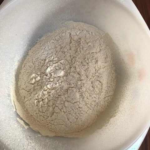 Dry ingredients added to a bowl.