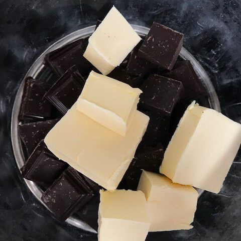 Butter and chocolate chunks in a bowl.