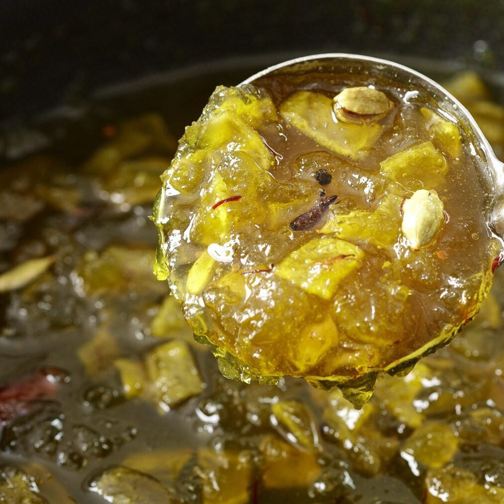 Cooled keri murabba in a ladle.