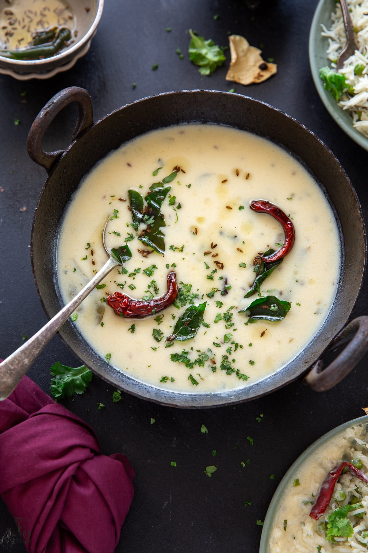 Gujarati kadhi served with matar pulao and papad. 