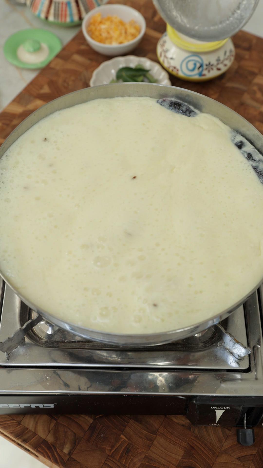 Boiling kadhi in a pan. 