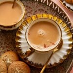 Few saffron strands garnished over indian chai in cups.