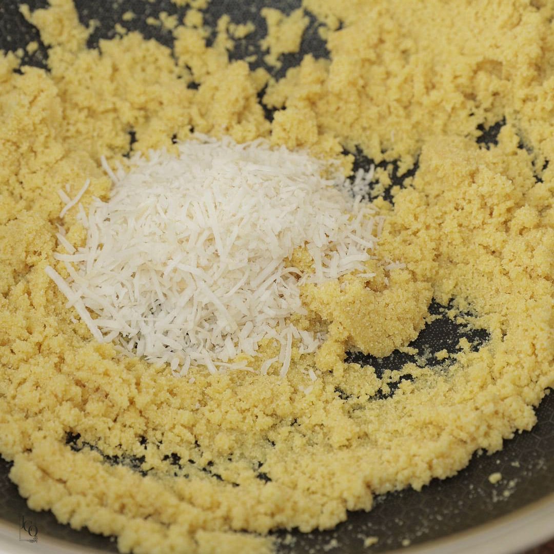 Shredded coconut added to roasted semolina.