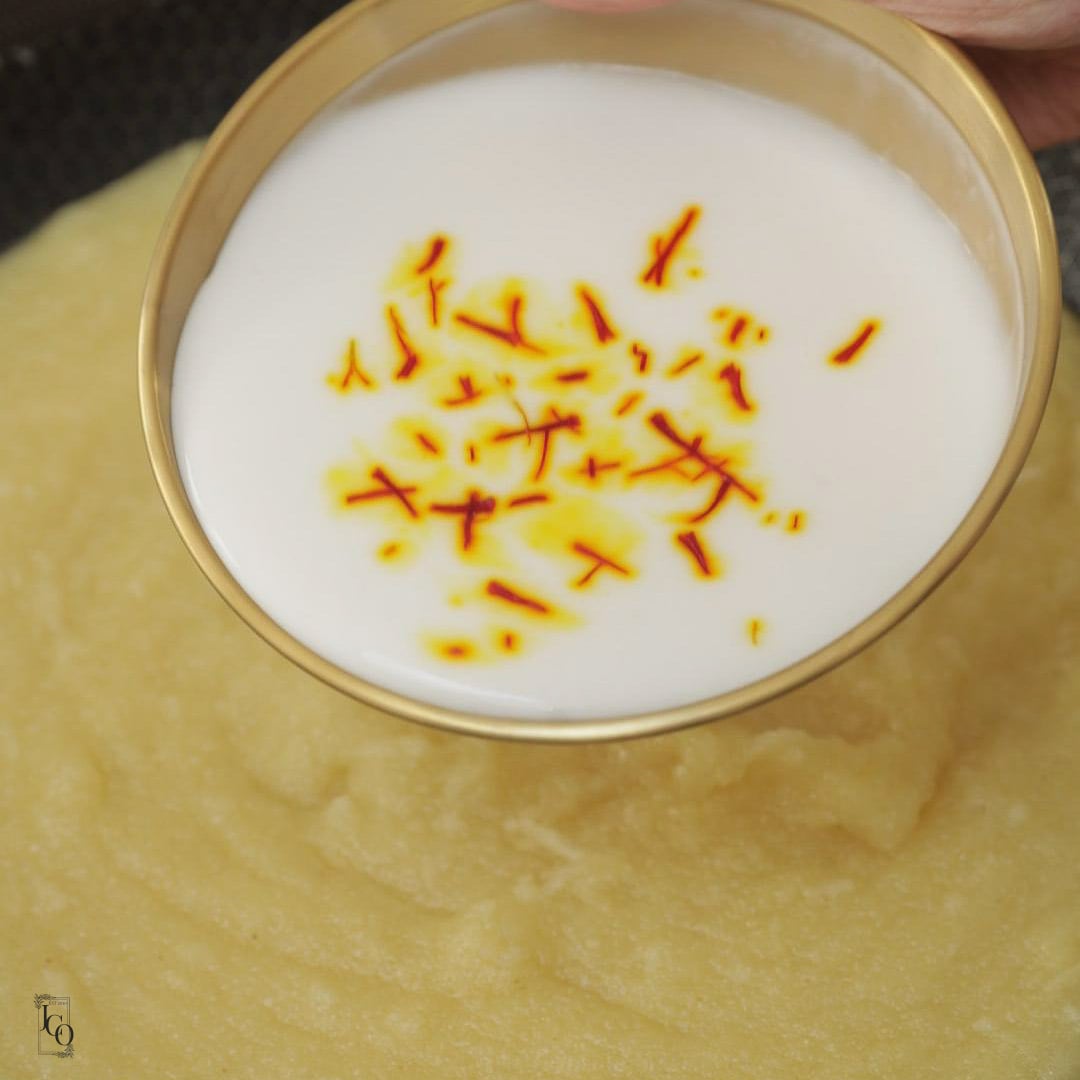 Saffron strands soaked in coconut milk added to semolina.