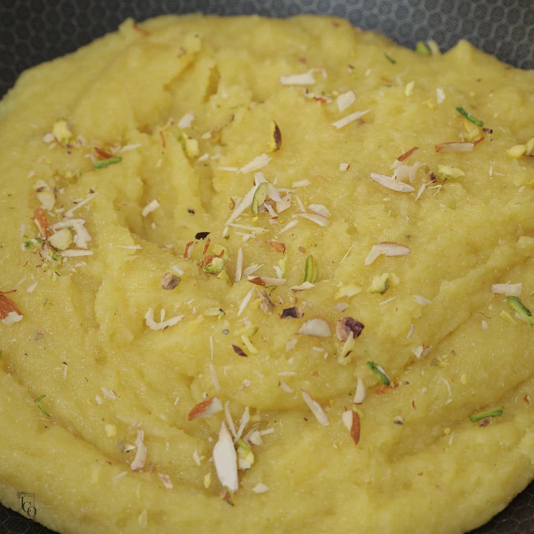 Chopped mixed nuts added to halwa.