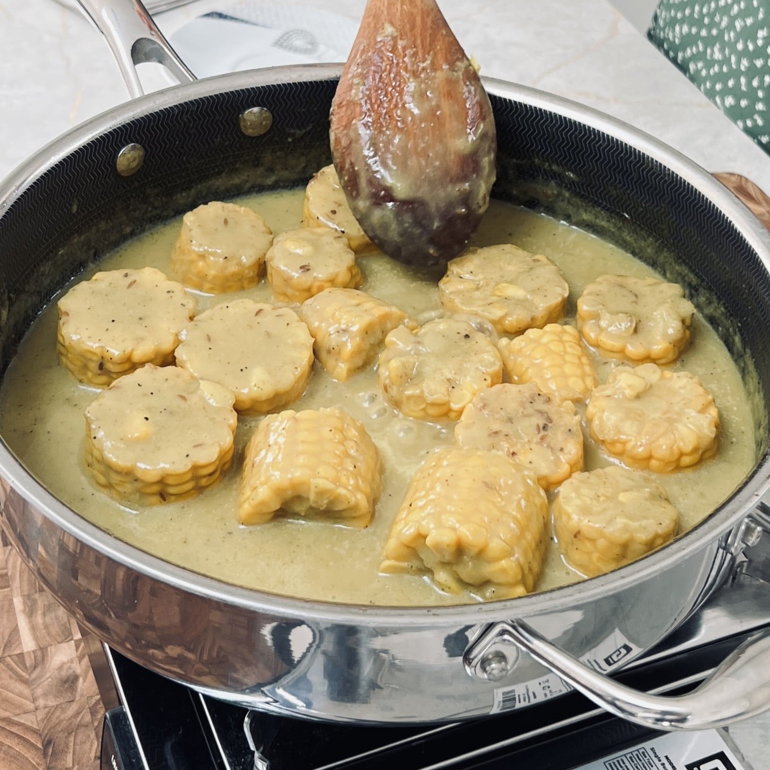 Corn cobs in a thick coconut gravy.