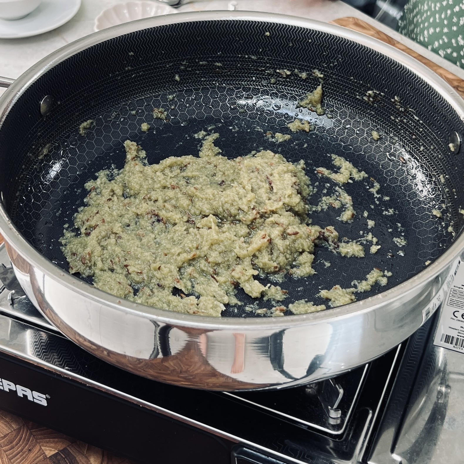 Cooked onion puree in a pan.