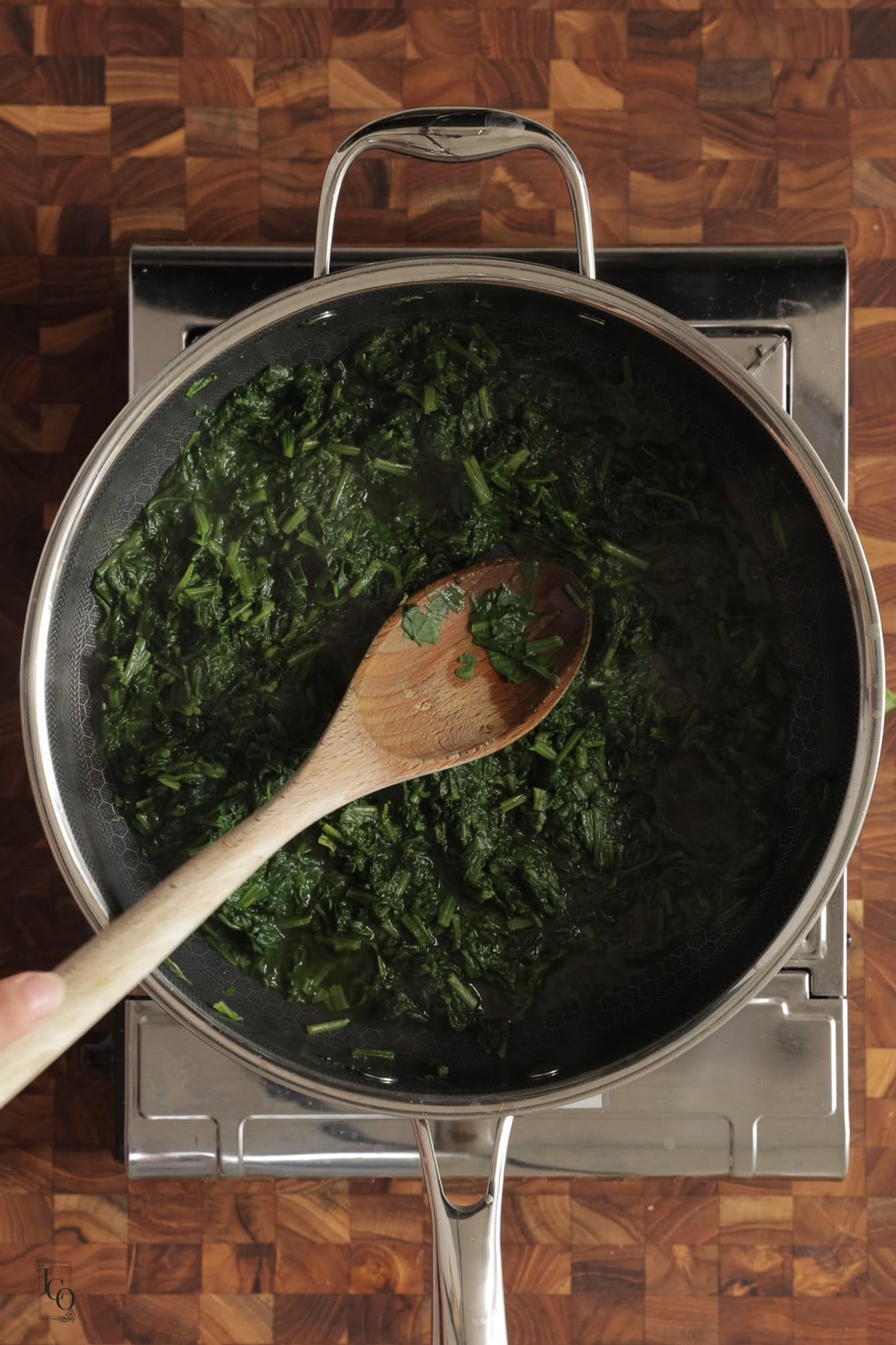 Cooked mashed spinach in a pan.