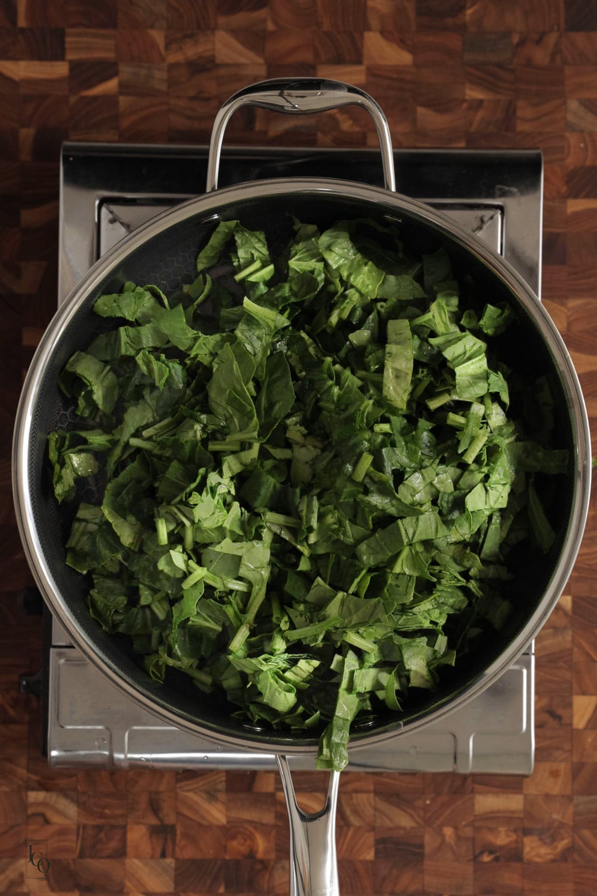 Fresh chopped spinach in a pan.