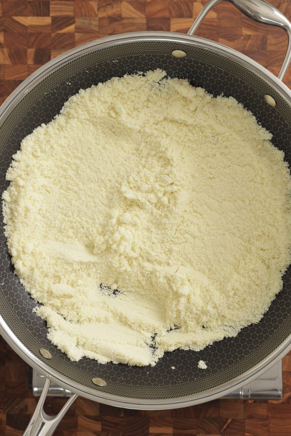 roasted milk powder with ground almonds in a wide mouth pan. 