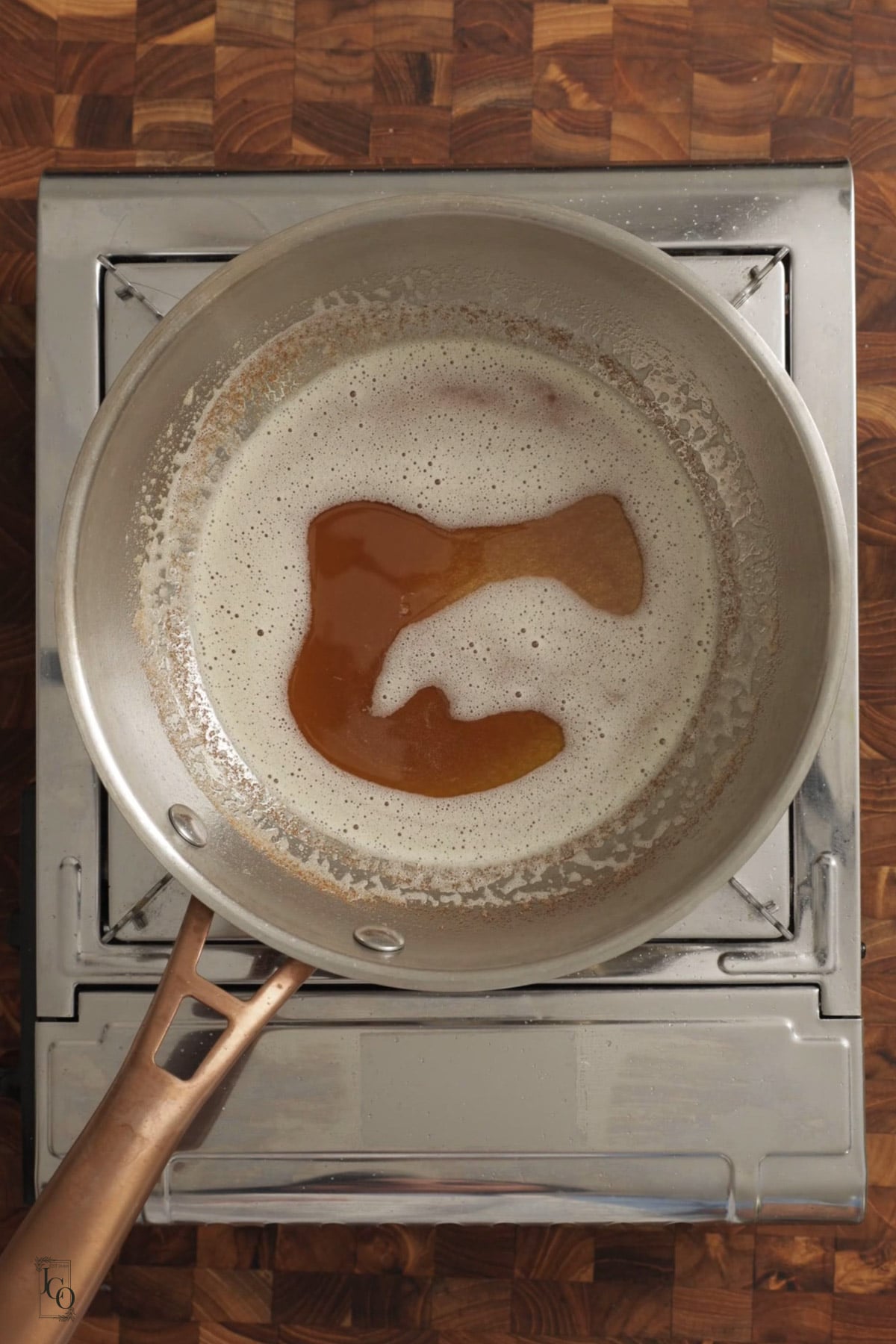 Melted brown butter in a frying pan. 