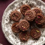Chocolate peda stacked in a decorative round plate.