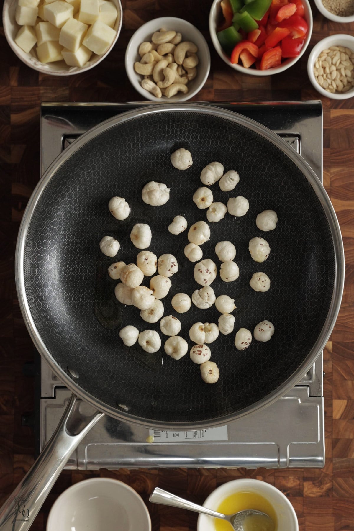 Makhana roasting in a pan.
