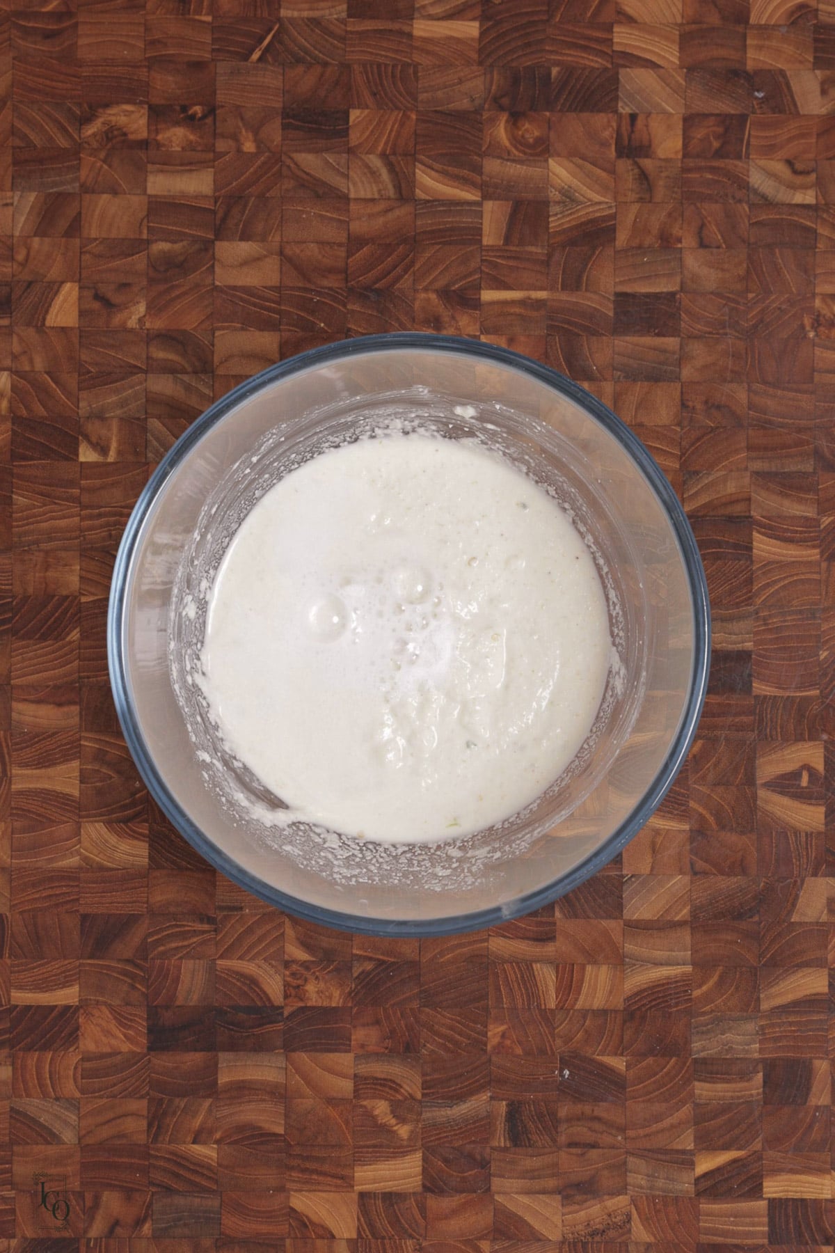 Eno fruit salt added to semolina batter, tiny bubbles shows on the surface of the batter.
