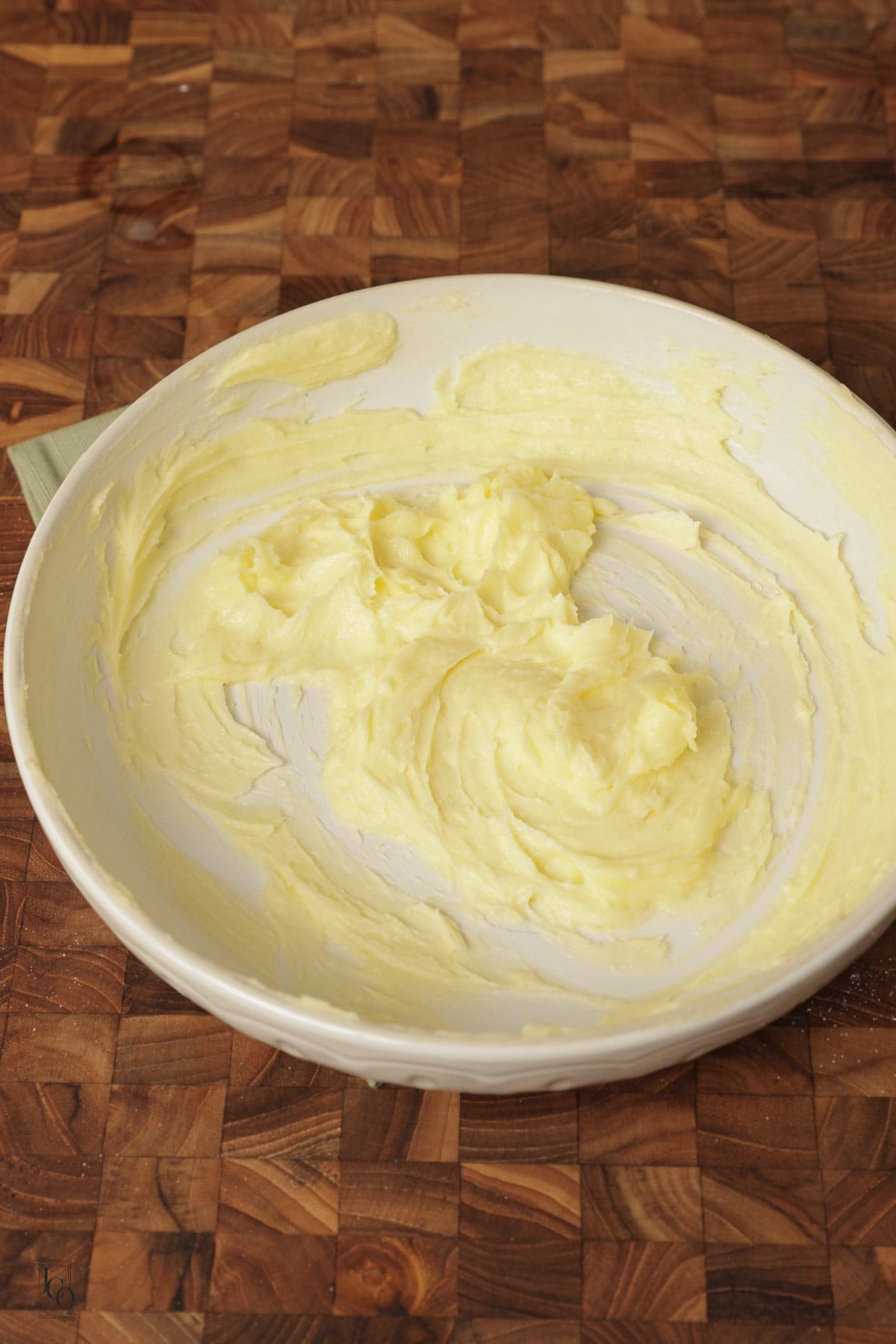 Butter and sugar creamed in a mixing bowl.